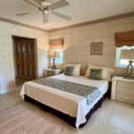 Royal Westmoreland Forest Hills 6 master bedroom bed and bathroom view